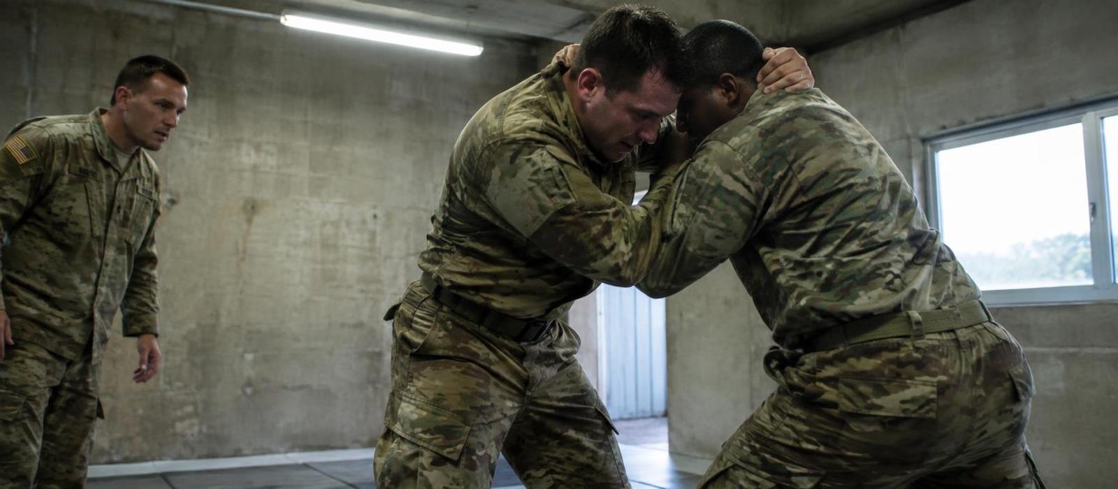 Soldiers drilling a standing clinch in a concrete training bay Soldiers drilling a standing clinch in a concrete training bay